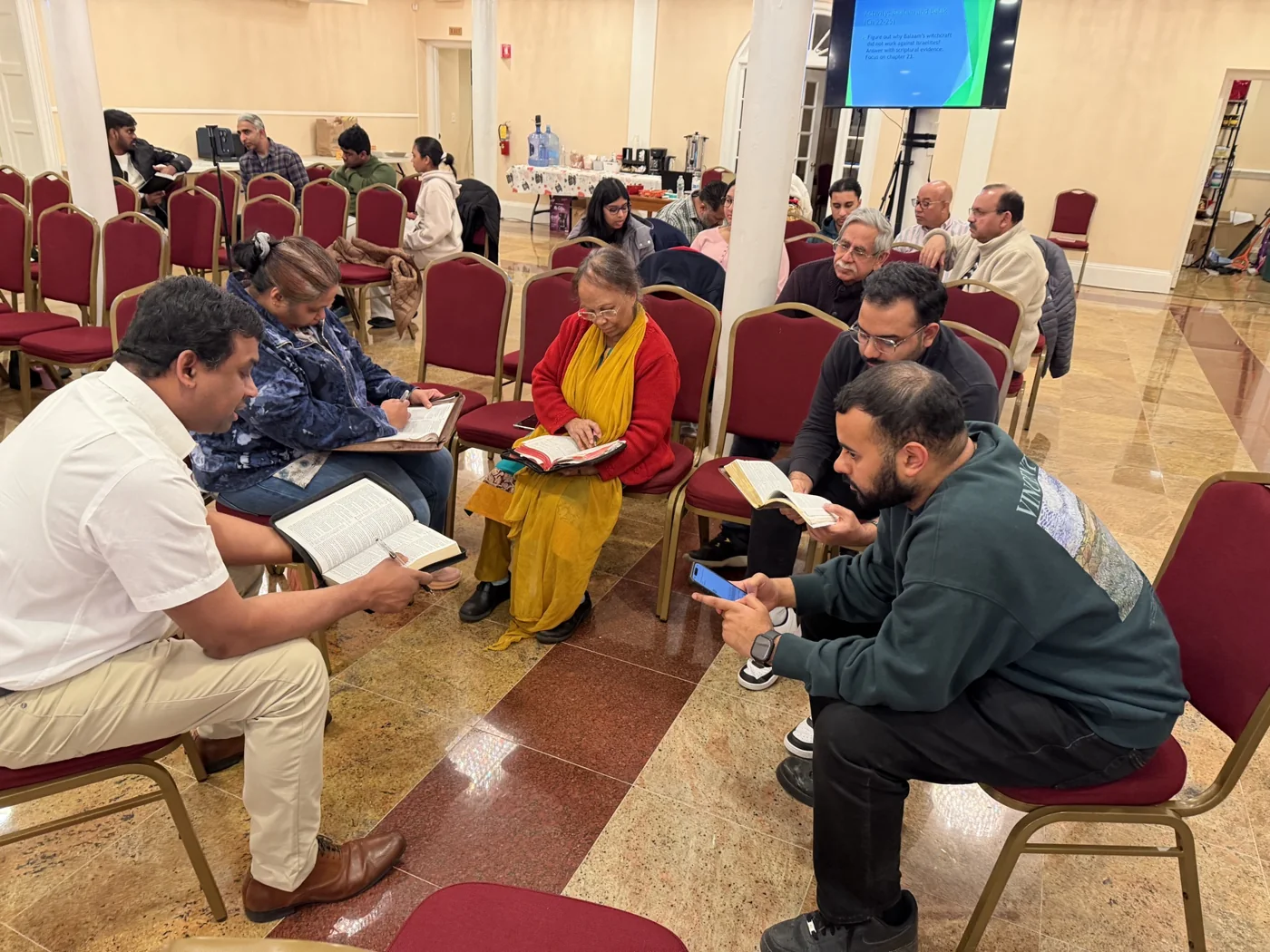 Bethel members reading and discussing the Bible together